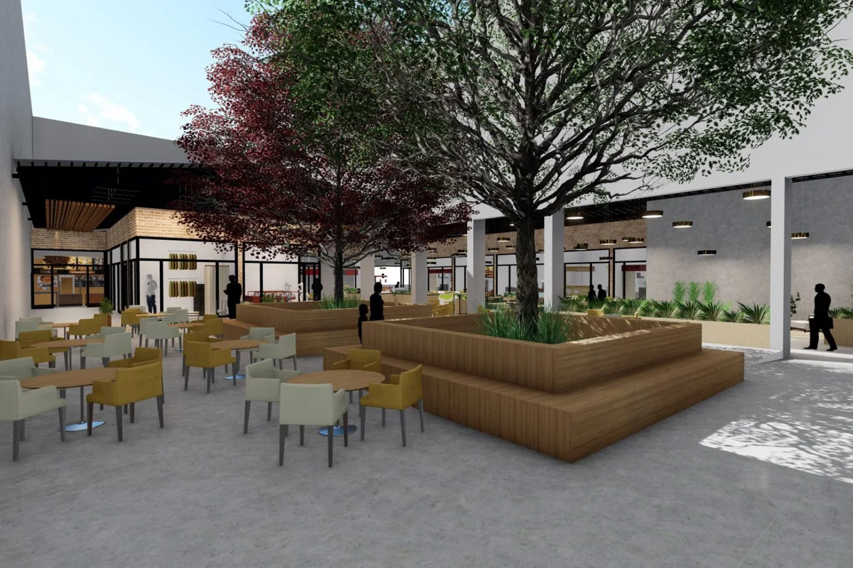 Render da praça de alimentação interna do Vila Osvaldo, com árvores, mesas e lojas ao redor