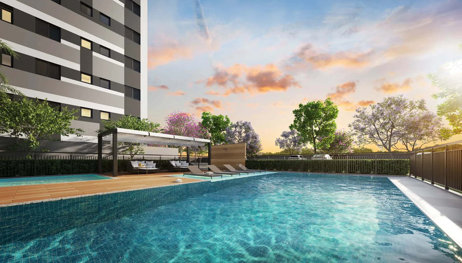 Piscina adulto do Vitta Arysta, com deck, espreguiçadeiras e pergolado, ao lado de uma das torres