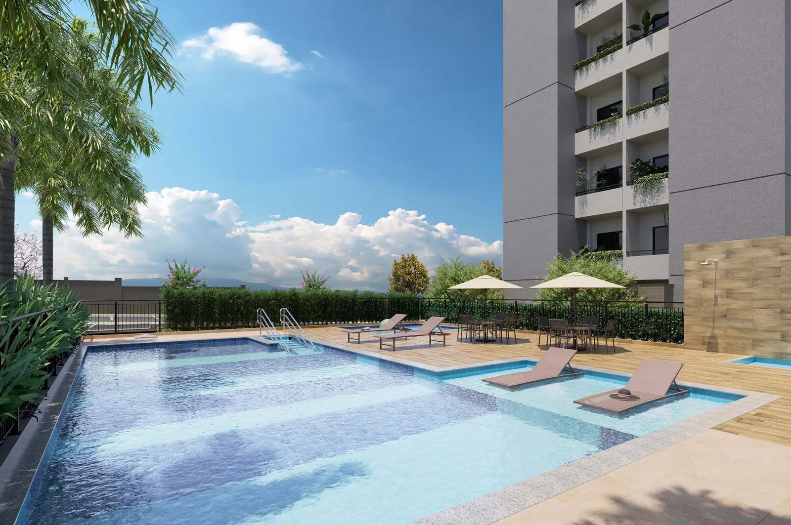 Complexo de piscinas do Vitta Origon, com piscina adulto, deck com espreguiçadeiras e uma das torres ao fundo